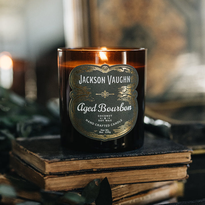 Jackson Vaughn Aged Bourbon candle in an amber glass jar